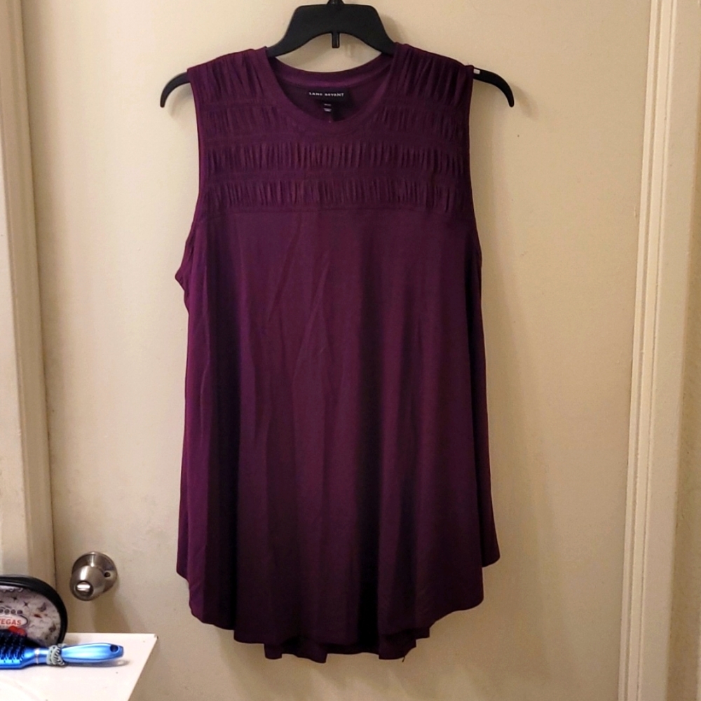 Lane Bryant's Sleeveless blouse that that's purple and comes in size 18/20